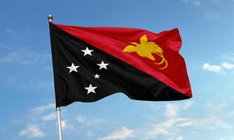 Papua New Guinea flag flying in the wind photo