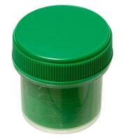 Plastic jar with green gouache paint, closed with green lid, isolated on background. photo
