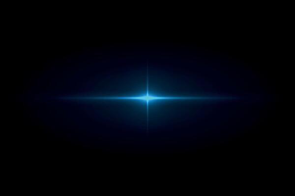 Blue glowing star light flare in dark background