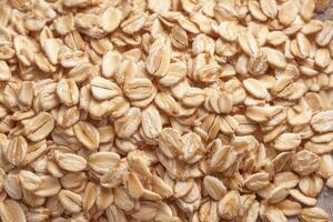 Rolled Oats Macro Photography High Resolution Texture of Dry Oatmeal Grains photo