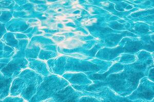 A close up of a blue pool with water photo