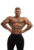 High level professional bodybuilder showing lats in front photo