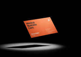 Business card mockup floating in a dark minimal background with dramatic spotlight effect psd