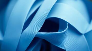 Extreme macro imagery of a ribbon is arranged into a logo with clear structure, geometric balance, and fine detailing. photo