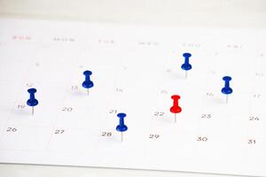 date marked push pin on calendar for background photo