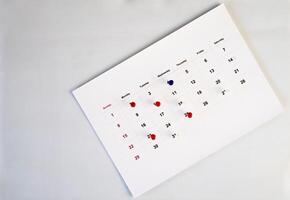 deadline concept with push pin on calendar date photo