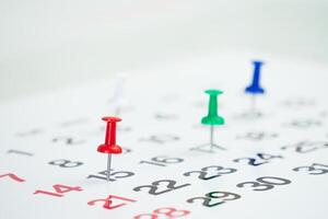 deadline concept with push pin on the calendar date photo
