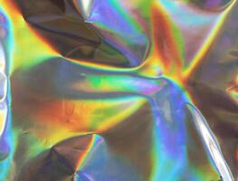 hologram surface wrinkled with rainbow texture background photo