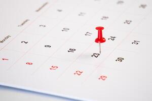 meeting calendar with red pin for background photo