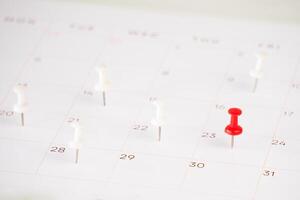 calendar and marked date with push pin photo