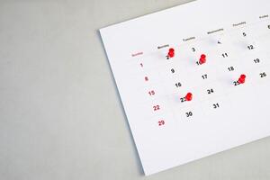 background of calendar and red push pin photo