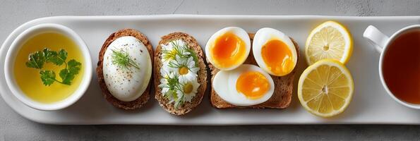 Colorful breakfast platter with eggs, lemon, and herbal soup. Wellness healthy diet. photo