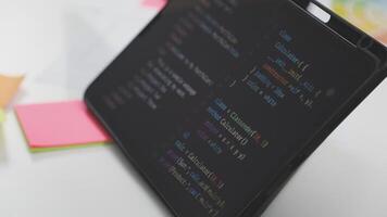 A laptop with a programming code on it video