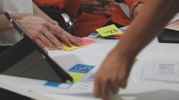People working on a white board with sticky notes video