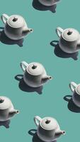 Pattern with many teapot animated on mint background. Teapot move in different directions. vertical footage video
