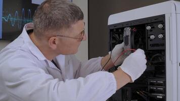 Technician repairing computer hardware with tools and gloves, Engineer in lab coat working on internal PC components with precision video