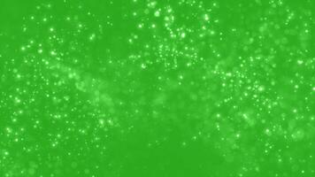 Movement of abstract glowing particles, shiny fairy tale flickering stars and sparkles. Chromakey - Green Screen. Background for holidays, New Year and Christmas. Seamless cycle video