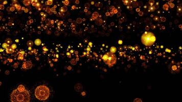 Loop glow orange spark particles bomb falling on black abstract background video