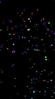 Colorful confetti burst - confetti explodes from the bottom of the frame then double pops and falls glittering to the ground. Festive celebration concept. Overlay with alpha channel. video