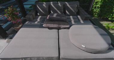 A patio with a couch and a table video
