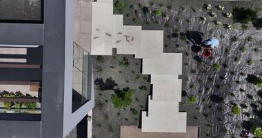 An aerial view of a courtyard with plants and a walkway video