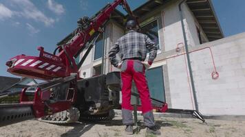 A man standing next to a large machine video