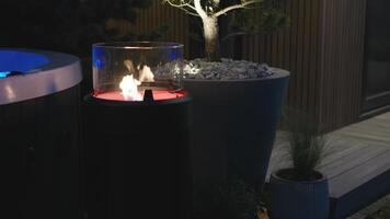 A fire pit in the backyard with a tree in the background video