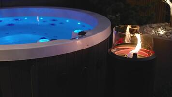 A hot tub with a candle lit in the water video