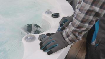A person is using a hose to clean a hot tub video