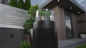 A black and white lamp sitting on a patio video