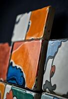 close up of some colorful tiles on a wall photo