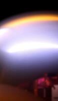 blurry image of a white object with a black background photo
