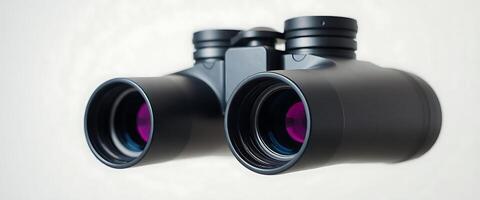 pair of binoculars sitting next to each other photo