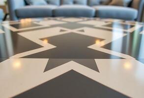 room with a couch and a star pattern on the floor photo