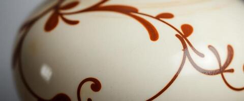 A close up of a vase with a design on it photo