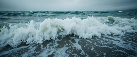 large body of water with waves crashing on it photo