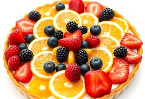 fruit tart topped with oranges, strawberries, and blueberries photo