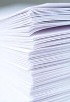A stack of white paper is shown in the photo