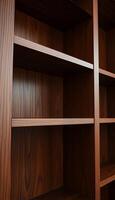 wooden bookcase with three shelves in it photo