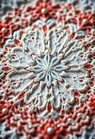 A close up of a lace pattern on a white table photo