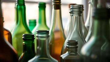 group of different colored bottles sitting next to each other photo