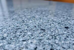 close up of a counter top with blue speckles photo