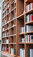 A library with many bookshelves and a desk photo