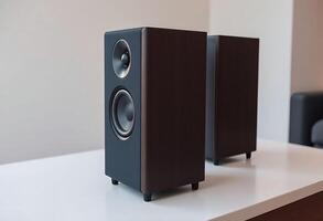 pair of speakers sitting on top of a table photo