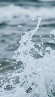 close up of water splashing on the surface of the ocean photo