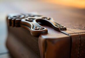 A close up of a suitcase with a handle photo