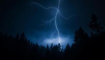 Lightning strikes over a forest in the dark photo
