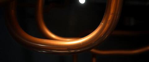 close up of a metal tube with a light in the background photo