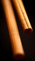 close up of two wooden sticks on a table photo