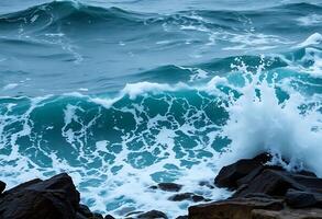 Waves crashing on rocks in the ocean photo